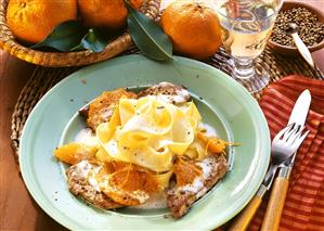 Veal escalope with mandarins & ribbon noodles on plate