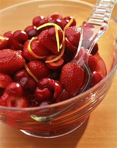 Strawberry and cherry salad in glass dish