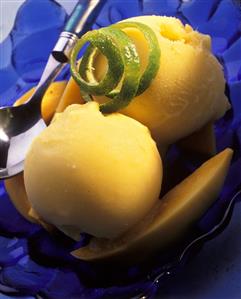 Mango sorbet in a blue glass dish