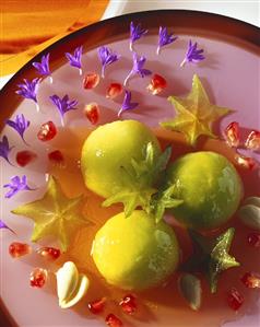 Star fruit ice cream with pomegranate sauce