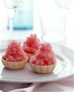 Raspberry sorbet in white chocolate bowl