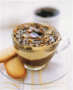 Light and dark chocolate mousse with caramel in glass cup