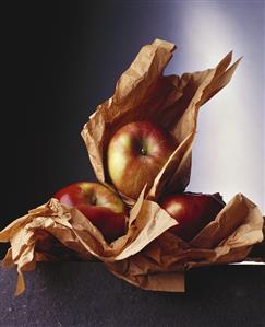 Apples in brown wrapping paper