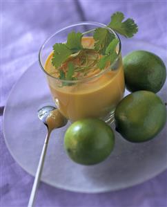 Cold carrot and ginger soup in glass