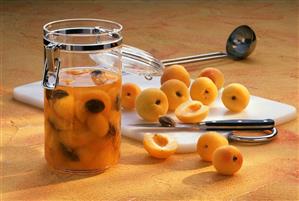 Home-made apricot brandy in glass and fresh apricots