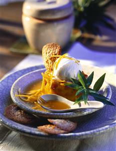 Baked pineapple tower with a scoop of coconut ice cream