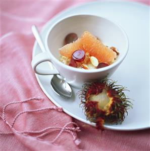 Sweet millet porridge with grapefruit, grapes & nuts