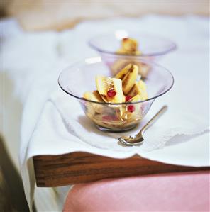 Baked bananas with pomegranate seeds in two dishes