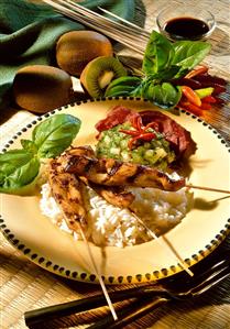 Chicken breast kebabs on rice with kiwi & honey sauce