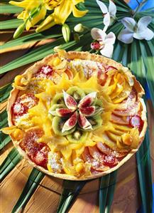 Fruit tart on palm leaves