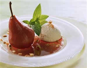 Red wine pears with vanilla ice cream and walnut kernels