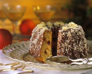 Coconut and pineapple ring and cake tongs on cake plate