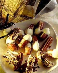 Stuffed dates and orange sticks with chocolate coating