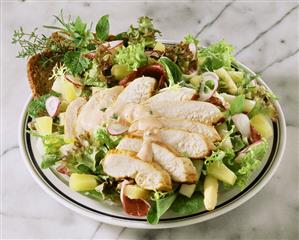 Mixed salad with turkey breast fillet and pineapple