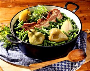 Pears, green beans and bacon in pot