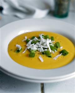 Cream of pumpkin soup with flaked coconut