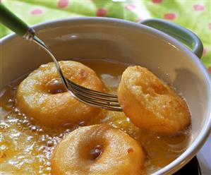 Fresh Apple Fritters Frying in Oil