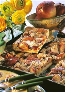 Tray-baked nectarine cake, one piece on cake slice
