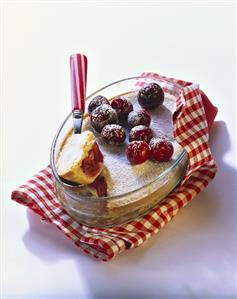 Warm cherry flan in baking dish