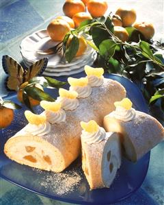 Sponge roll with mandarin cream, decoration: mandarins