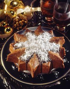 Spice cake star with chocolate icing and grated coconut