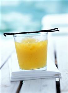 Mango drink with crushed ice and vanilla pods