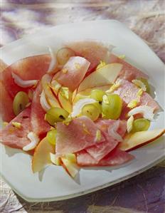 Melon salad with apple slices and grapes