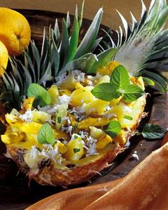 Chicken breast & pineapple salad with coconut flakes