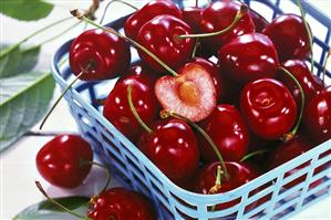 Heart cherries in blue basket