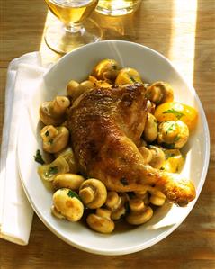 Chicken leg with lemon and mushrooms