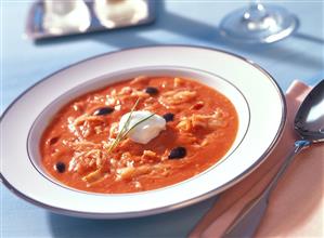 Sauerkraut and tomato soup with black olives and cream