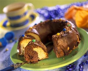 Marble cake ring with chocolate icing and chocolate beans