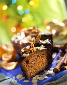 Spiced cake for Christmas with chocolate icing, pieces cut