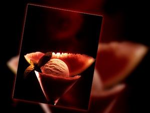 Melon ice cream in glass, decorated with watermelon wedge