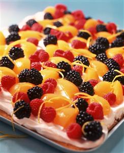 Tray-baked lemon cake with fruit topping