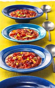 Mexican bean soup on blue plates