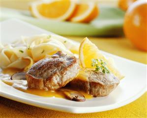 Pork medallions with orange sauce