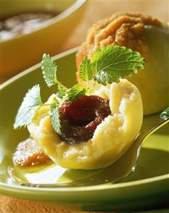 Plum dumplings with brown buttered breadcrumbs