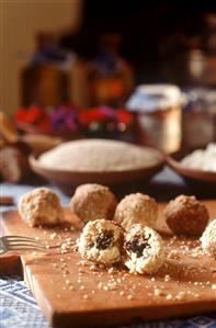 Curd cheese dumplings with plum filling on kitchen board