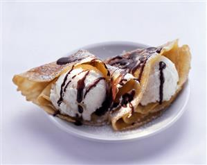 Two crepes with vanilla ice cream & chocolate sauce