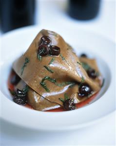 Spicy chicken wrapped in chocolate lasagne with cranberry sauce