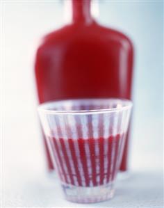 A beaker of beetroot soup