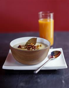 Potato soup with pecan nuts & a glass of multivitamin juice