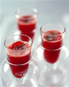 Chilled gazpacho (tomato & vegetable soup) in glass beakers