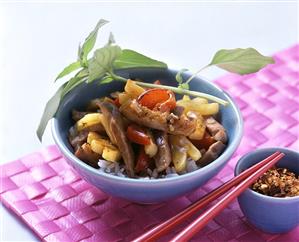 Duck with pineapple, peppers and rice in bowl (2)