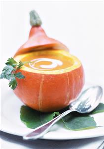 Pumpkin soup with crème fraiche in hollowed-out pumpkin