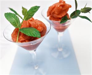 Strawberry sorbet, garnished with lemon balm