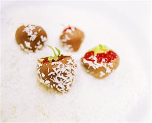 Chocolate-coated strawberries with grated coconut