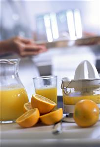 Still life with freshly squeezed orange juice & oranges (1)