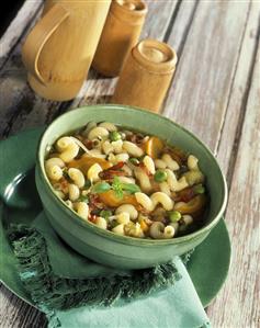 Vegetable soup with noodles and diced bacon